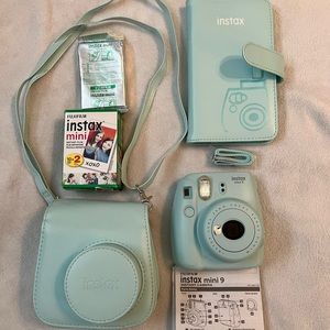 Instax mini camera with everything shown